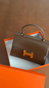 Hermes formal sling bag with top handle