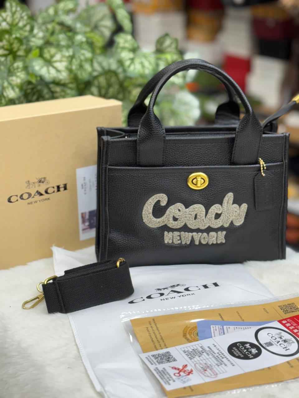 Luxury Coach cargo bag in town for women