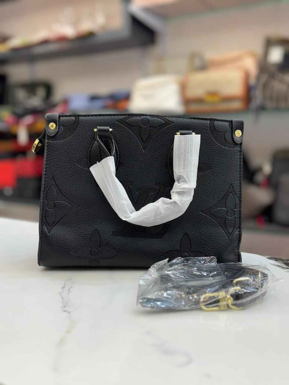 Louis Vuitton Lv on the go tote with coin pouch