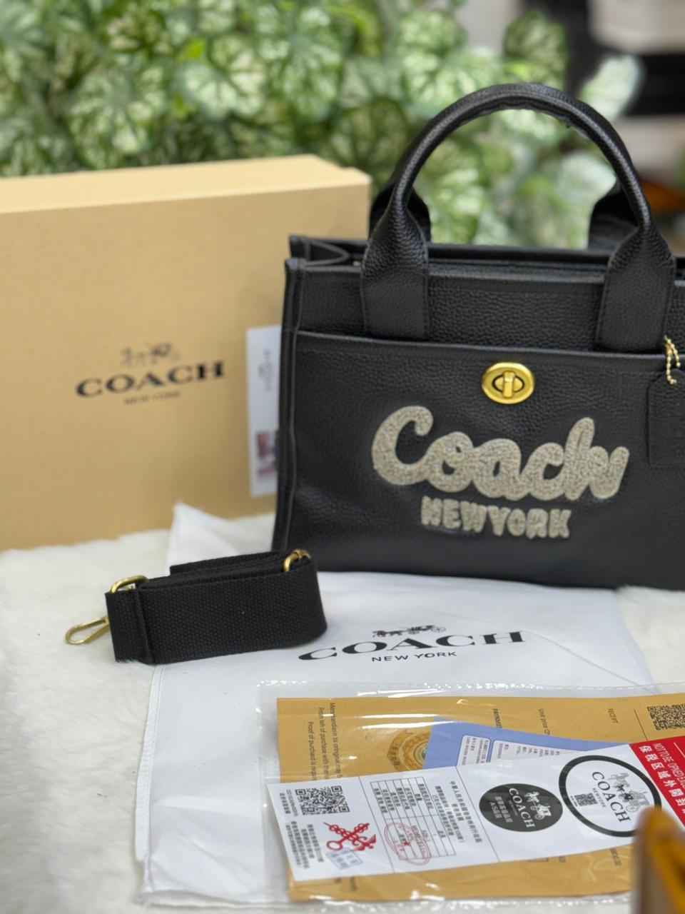 Luxury Coach cargo bag in town for women