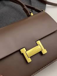 Hermes formal sling bag with top handle