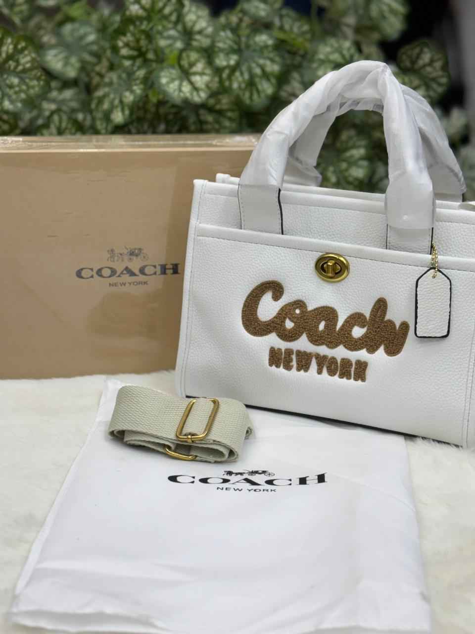 Luxury Coach cargo bag in town for women