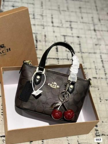Coach mini crossbody bag with cherry charm