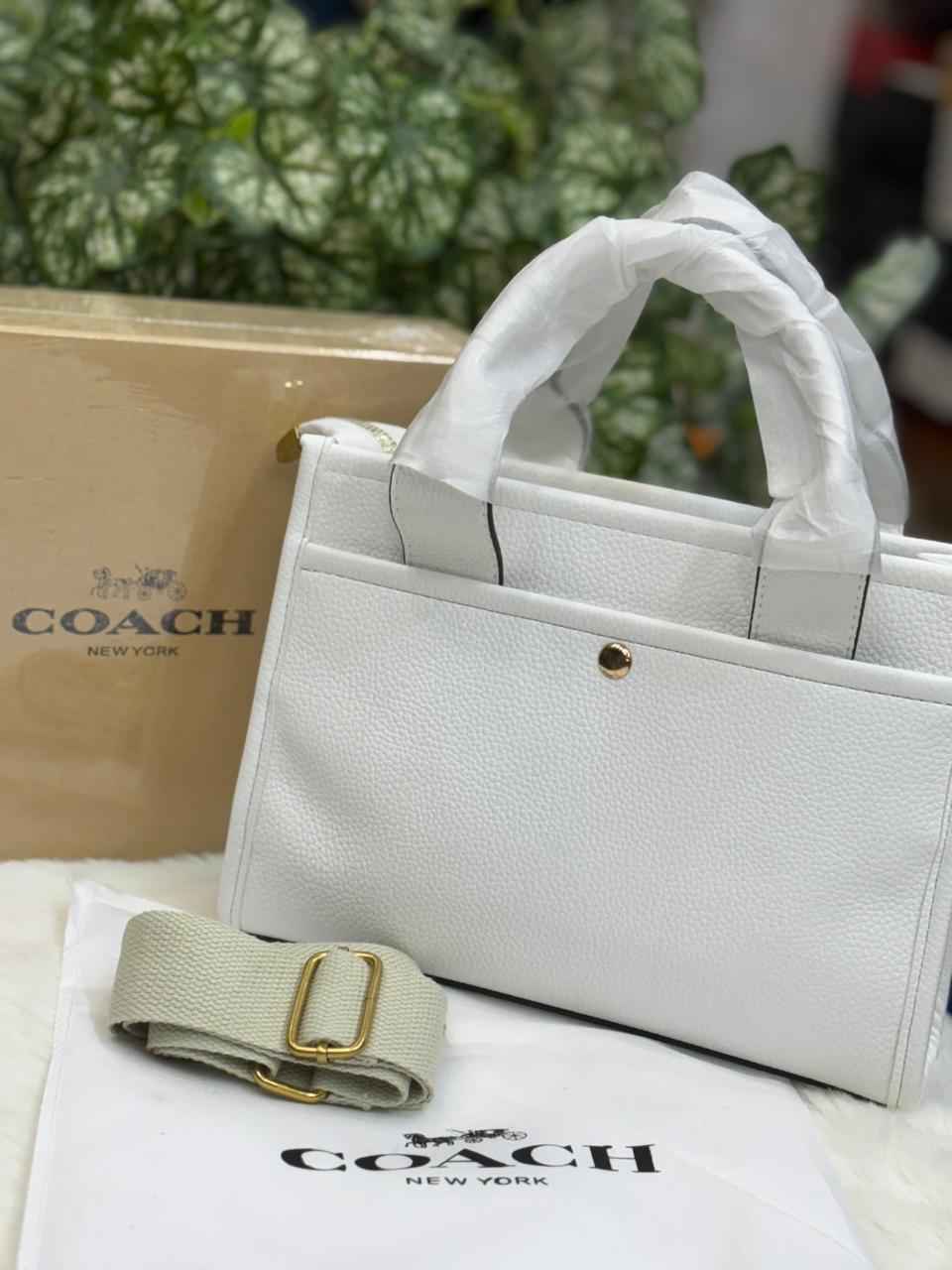 Luxury Coach cargo bag in town for women