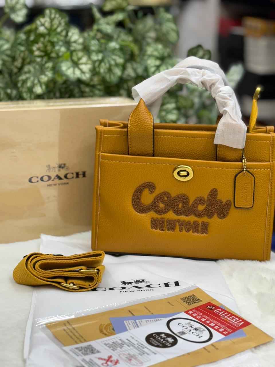Luxury Coach cargo bag in town for women