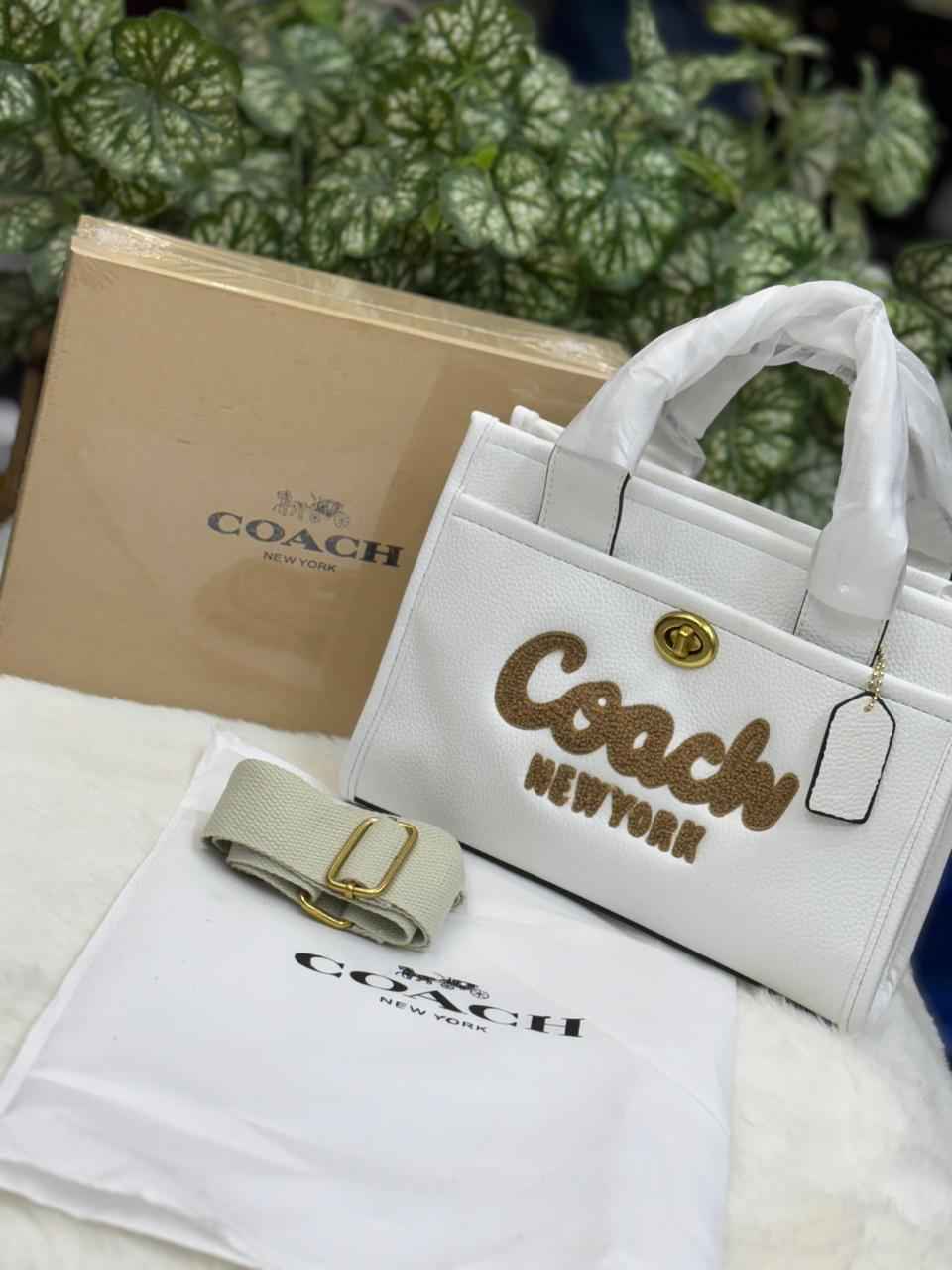 Luxury Coach cargo bag in town for women