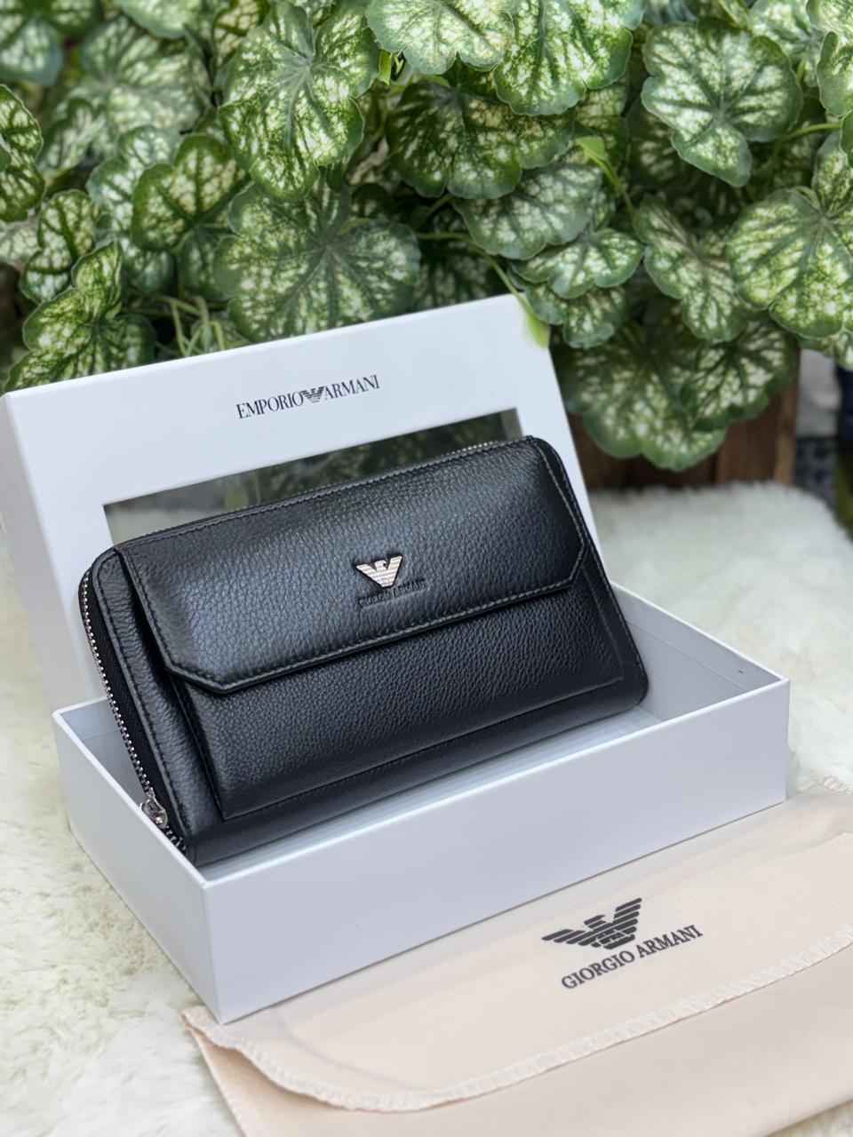 Luxury Armani wallet in genuine leather next to original quality