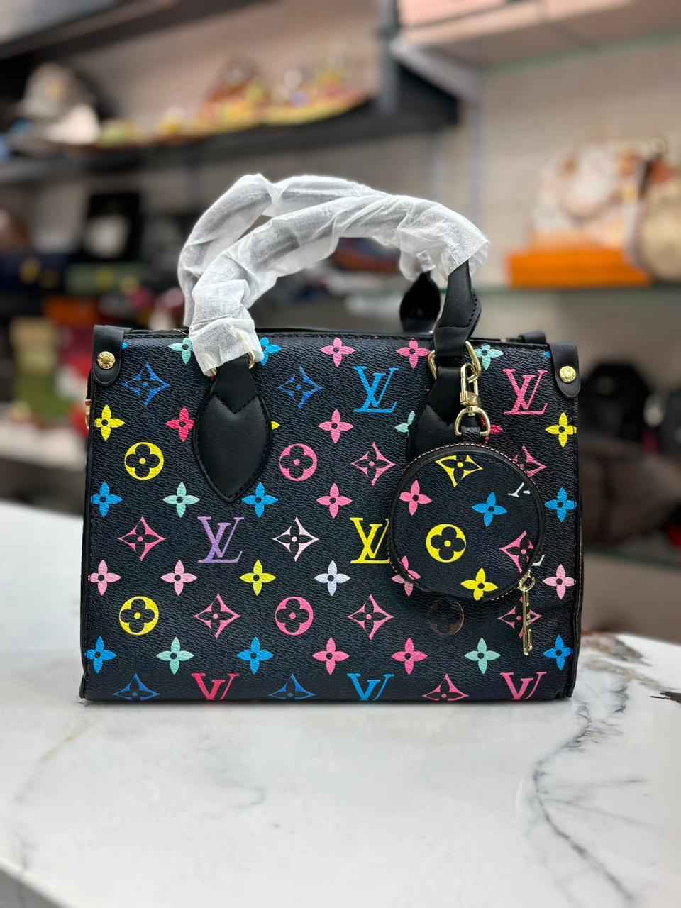 Louis Vuitton Lv on the go tote with coin pouch