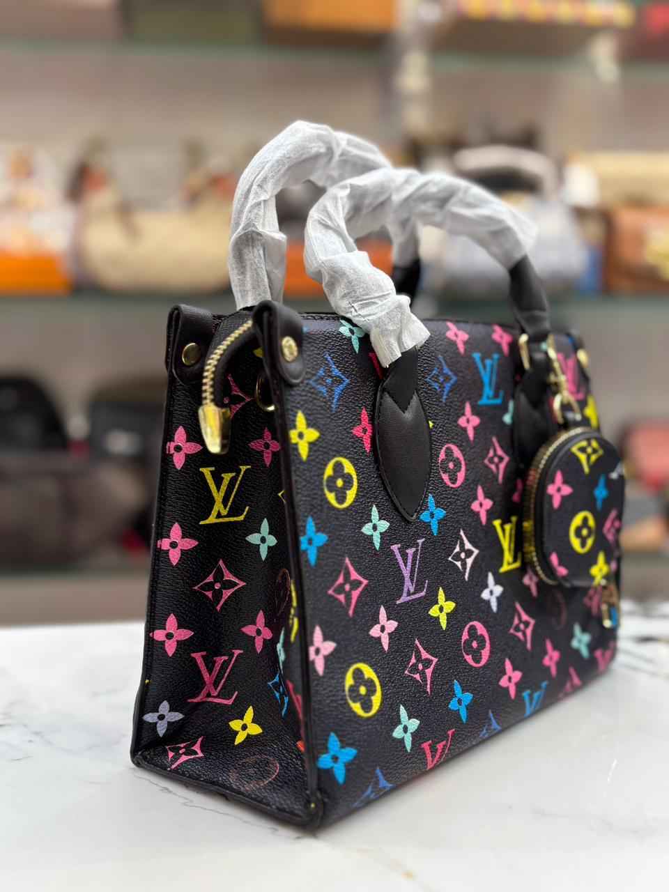 Louis Vuitton Lv on the go tote with coin pouch