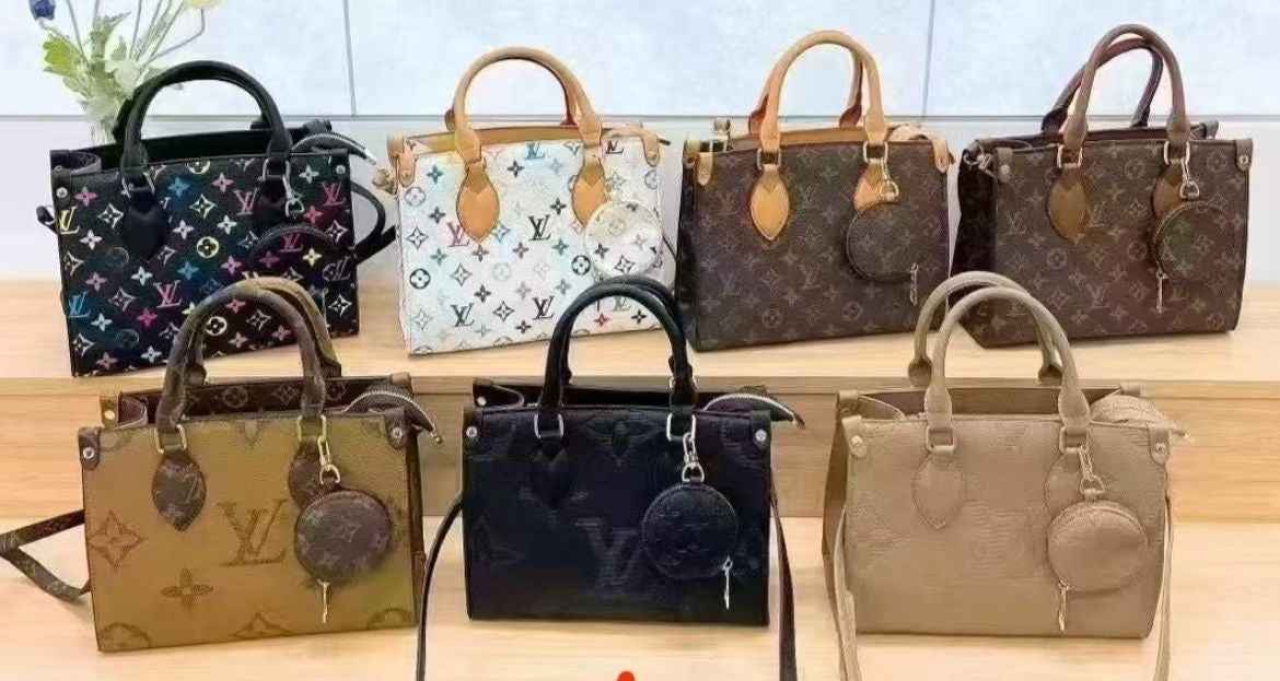 Louis Vuitton Lv on the go tote with coin pouch