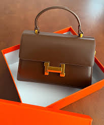 Hermes formal sling bag with top handle