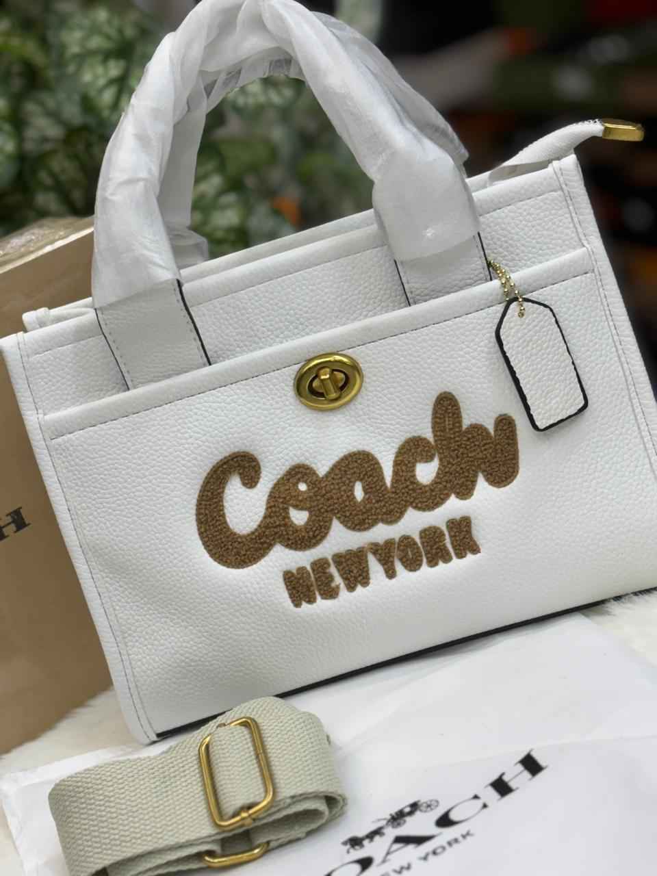 Luxury Coach cargo bag in town for women