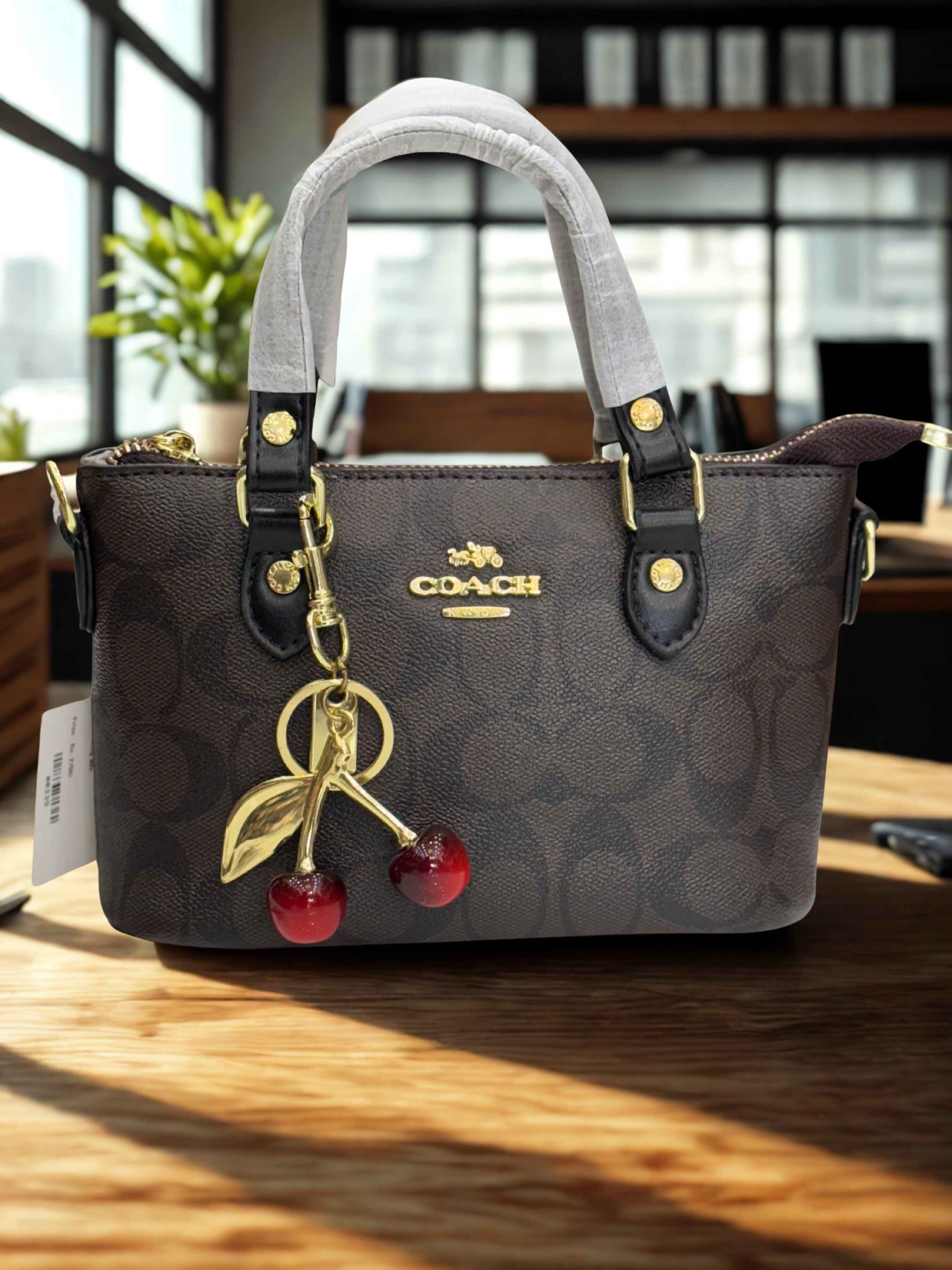 Coach mini crossbody bag with cherry charm