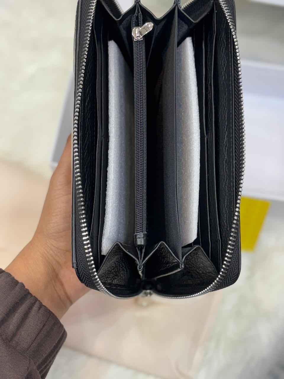 Luxury Armani wallet in genuine leather next to original quality